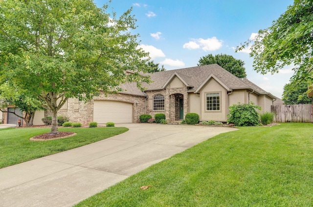382 S Yellowwood Dr, Springfield, MO 65809 - view of front of house featuring a garage, concrete driveway, roof with shingles, and stucco siding