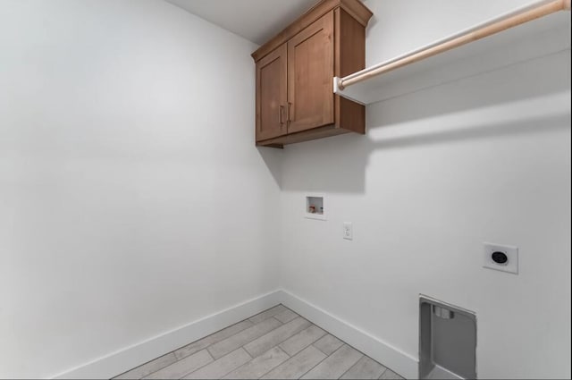 1108 W Pebblebrooke Dr, Ozark, MO 65721 - laundry room featuring hookup for an electric dryer, baseboards, cabinet space, and hookup for a washing machine