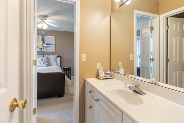 1394 Bee Creek Rd, Branson, MO 65616 - bathroom with ceiling fan, vanity, and a textured ceiling