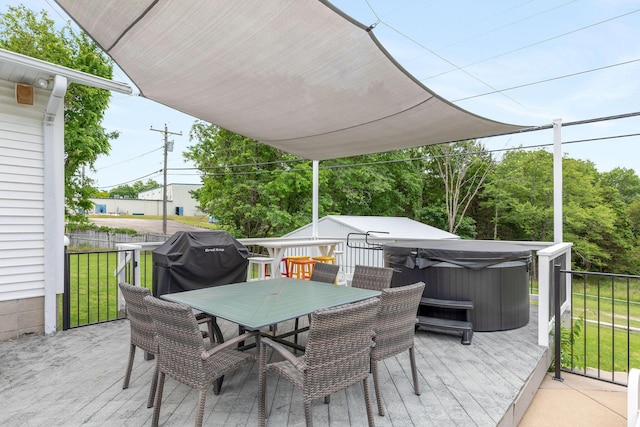 1394 Bee Creek Rd, Branson, MO 65616 - deck with a hot tub, outdoor dining space, and a yard