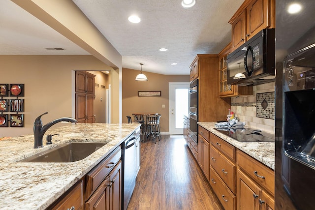 1394 Bee Creek Rd, Branson, MO 65616 - kitchen featuring a sink, brown cabinets, black appliances, decorative backsplash, and dark wood-style flooring
