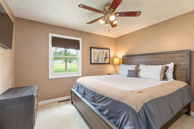 1394 Bee Creek Rd, Branson, MO 65616 - bedroom featuring light colored carpet, baseboards, ceiling fan, and a textured ceiling