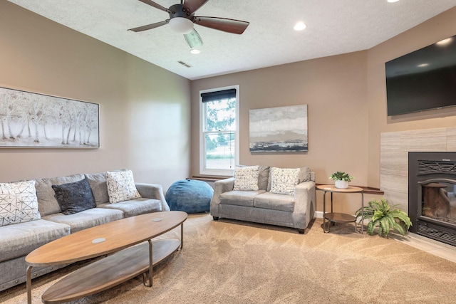 1394 Bee Creek Rd, Branson, MO 65616 - living room featuring carpet flooring, a fireplace, recessed lighting, a ceiling fan, and a textured ceiling