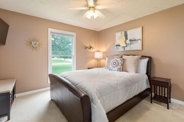 1394 Bee Creek Rd, Branson, MO 65616 - bedroom with light colored carpet, a textured ceiling, baseboards, and ceiling fan
