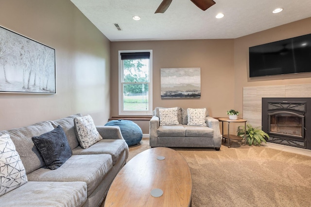 1394 Bee Creek Rd, Branson, MO 65616 - living area with carpet flooring, a tile fireplace, ceiling fan, recessed lighting, and baseboards