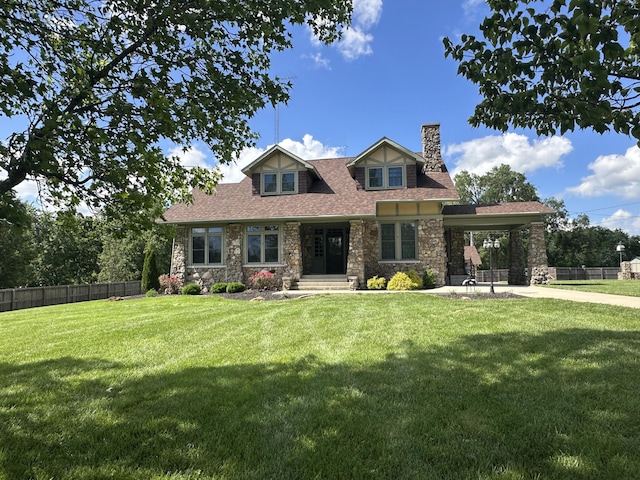 528 E Dorris Ave, Mountain Grove, MO 65711 - view of front of house featuring a chimney, stone siding, driveway, an attached carport, and roof with shingles