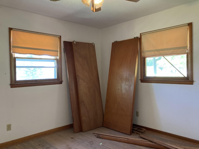 403 S W St, Mountain Grove, MO 65711 - unfurnished bedroom with multiple windows, wood finished floors, and baseboards