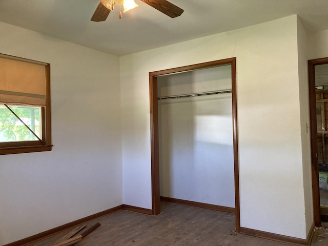 403 S W St, Mountain Grove, MO 65711 - unfurnished bedroom featuring wood finished floors, baseboards, a closet, and a ceiling fan