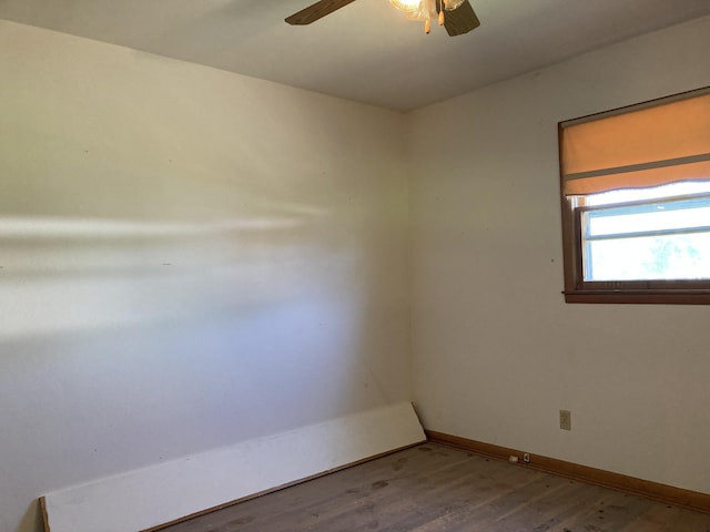 403 S W St, Mountain Grove, MO 65711 - unfurnished room with a ceiling fan, wood finished floors, and baseboards