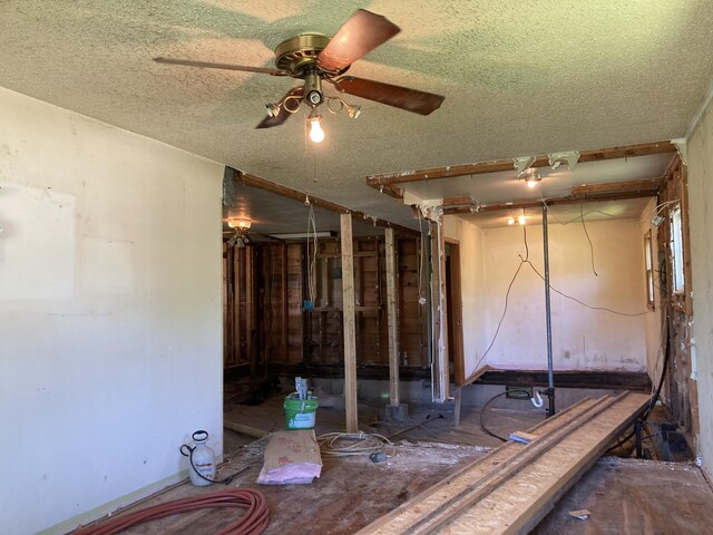 403 S W St, Mountain Grove, MO 65711 - spare room with a ceiling fan and a textured ceiling
