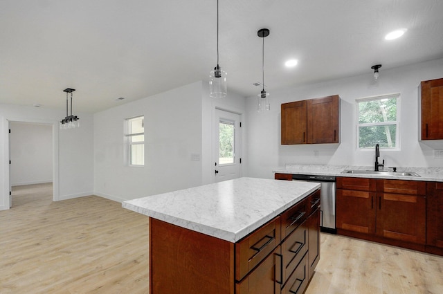1620 N Texas Ave, Springfield, MO 65803 - kitchen with a sink, stainless steel dishwasher, light countertops, light wood-style flooring, and recessed lighting