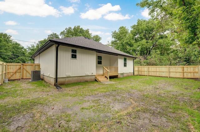 1620 N Texas Ave, Springfield, MO 65803 - back of property with cooling unit, a fenced backyard, and a shingled roof