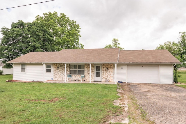 1623 W Commercial St, Buffalo, MO 65622 - ranch-style home featuring covered porch, asphalt driveway, an attached garage, and a front lawn