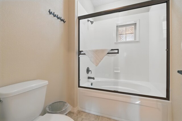 200 Majestic Dr Unit 1-208, Branson, MO 65616 - bathroom featuring toilet, bath / shower combo with glass door, and tile patterned floors