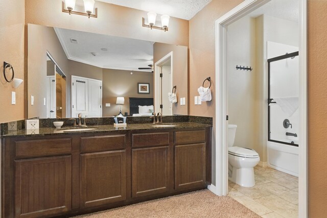 200 Majestic Dr Unit 1-208, Branson, MO 65616 - bathroom with double vanity, toilet, tub / shower combination, ornamental molding, and a ceiling fan