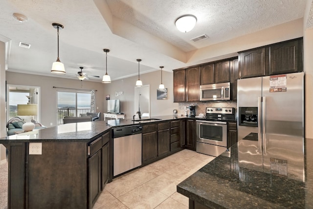 200 Majestic Dr Unit 1-208, Branson, MO 65616 - kitchen with stainless steel appliances, a peninsula, dark brown cabinets, ceiling fan, and a textured ceiling
