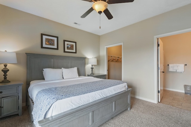 200 Majestic Dr Unit 1-208, Branson, MO 65616 - bedroom featuring light colored carpet, baseboards, a spacious closet, a ceiling fan, and a closet