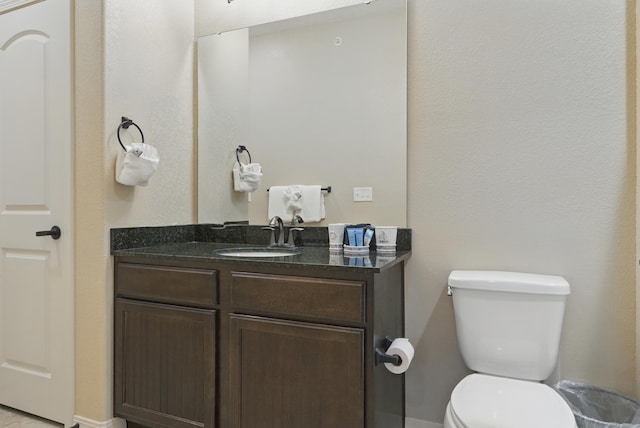 200 Majestic Dr Unit 1-208, Branson, MO 65616 - bathroom featuring toilet, vanity, and baseboards
