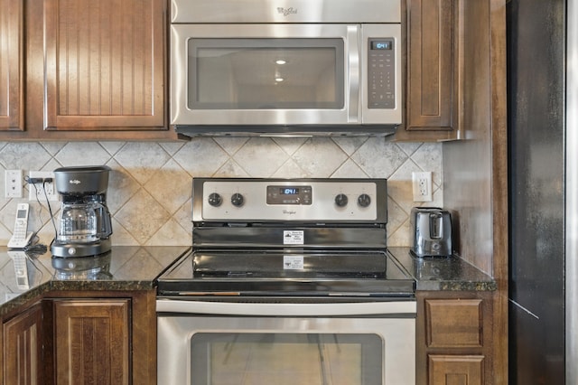 200 Majestic Dr Unit 1-208, Branson, MO 65616 - kitchen with appliances with stainless steel finishes and decorative backsplash