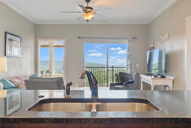 200 Majestic Dr Unit 1-208, Branson, MO 65616 - detailed view of a sink, dark stone countertops, ceiling fan, and crown molding