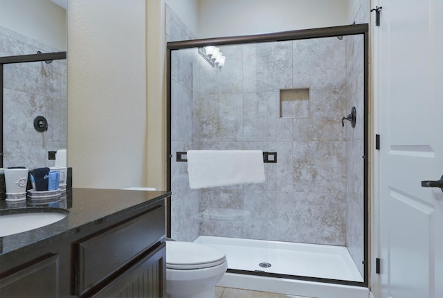200 Majestic Dr Unit 1-208, Branson, MO 65616 - bathroom featuring vanity, toilet, and a stall shower