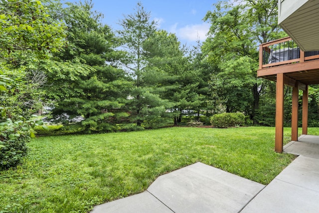 5142 S Burrows Ave, Springfield, MO 65810 - view of green lawn with a patio and a wooden deck