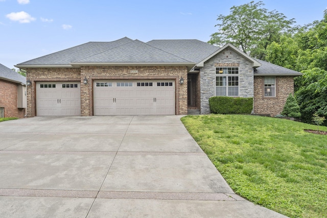 5142 S Burrows Ave, Springfield, MO 65810 - view of front of home featuring a garage, concrete driveway, brick siding, a front lawn, and a shingled roof