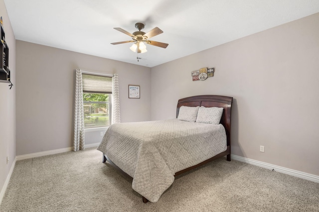 5142 S Burrows Ave, Springfield, MO 65810 - bedroom with baseboards, light carpet, and a ceiling fan