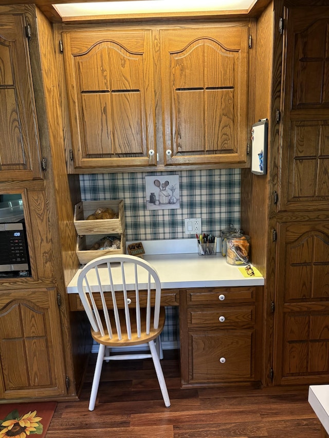 22389 Lawrence Unit 1215, Aurora, MO 65605 - office area featuring built in desk and dark wood-type flooring