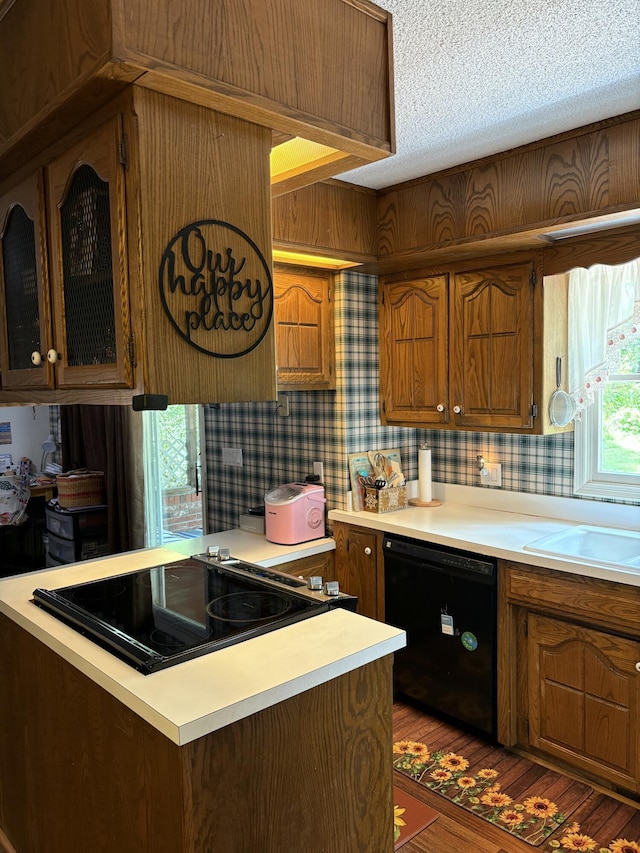 22389 Lawrence Unit 1215, Aurora, MO 65605 - kitchen with black dishwasher, cooktop, light countertops, and a textured ceiling