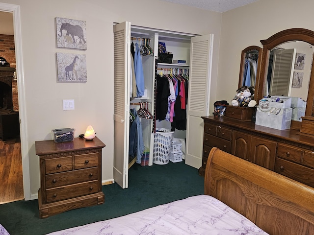 22389 Lawrence Unit 1215, Aurora, MO 65605 - bedroom with a closet and dark carpet