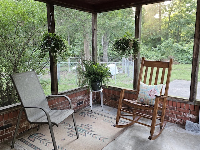 22389 Lawrence Unit 1215, Aurora, MO 65605 - sunroom featuring a view of trees
