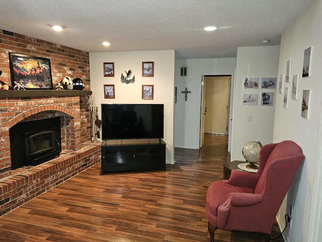 22389 Lawrence Unit 1215, Aurora, MO 65605 - living room featuring wood finished floors, a textured ceiling, recessed lighting, and a fireplace