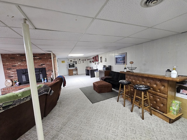 22389 Lawrence Unit 1215, Aurora, MO 65605 - carpeted living area with a paneled ceiling, a bar, and a wood stove