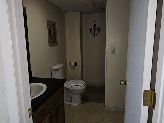22389 Lawrence Unit 1215, Aurora, MO 65605 - half bathroom featuring a paneled ceiling, vanity, and tile patterned floors