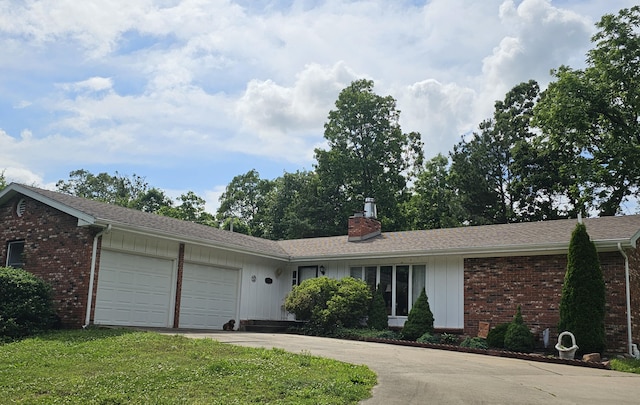 22389 Lawrence Unit 1215, Aurora, MO 65605 - single story home with an attached garage, concrete driveway, a chimney, brick siding, and board and batten siding