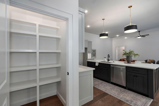 1698 N Marlowe Ave, Springfield, MO 65802 - kitchen featuring stainless steel dishwasher, a sink, light countertops, dark wood-style flooring, and recessed lighting