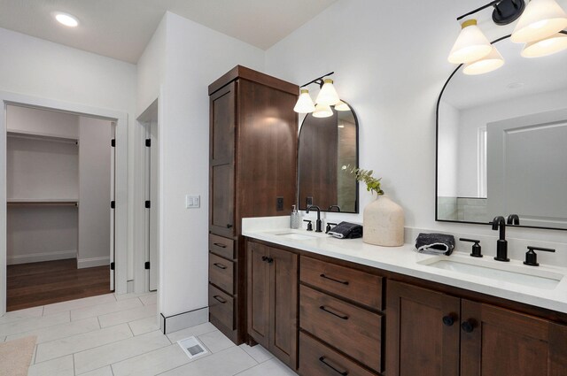1698 N Marlowe Ave, Springfield, MO 65802 - full bathroom with double vanity and tile patterned flooring