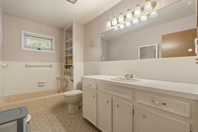 39 James River Rd, Kimberling City, MO 65686 - full bathroom with toilet, vanity, a tub to relax in, tile walls, and tasteful backsplash