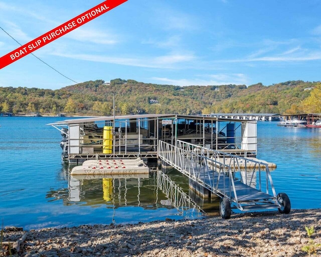 39 James River Rd, Kimberling City, MO 65686 - dock area featuring a wooded view and a water view