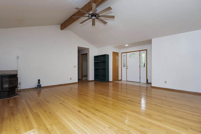 299 Regal Dr, Rogersville, MO 65742 - unfurnished living room with a wood stove, light wood finished floors, ceiling fan, and baseboards