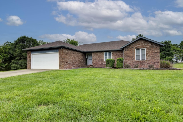 299 Regal Dr, Rogersville, MO 65742 - ranch-style home with brick siding, an attached garage, a front lawn, and concrete driveway