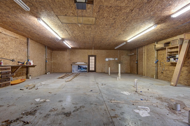 299 Regal Dr, Rogersville, MO 65742 - garage featuring a workshop area and a garage door opener
