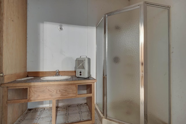 299 Regal Dr, Rogersville, MO 65742 - bathroom featuring a shower stall, tile patterned floors, and vanity