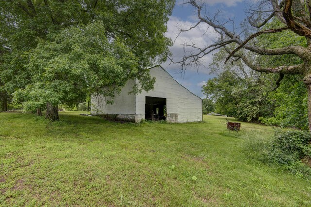 299 Regal Dr, Rogersville, MO 65742 - view of green lawn with an outbuilding