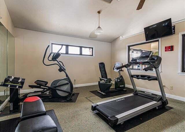 350 S Wildwood Dr Unit B-11, Branson, MO 65616 - workout room with baseboards, lofted ceiling, and carpet