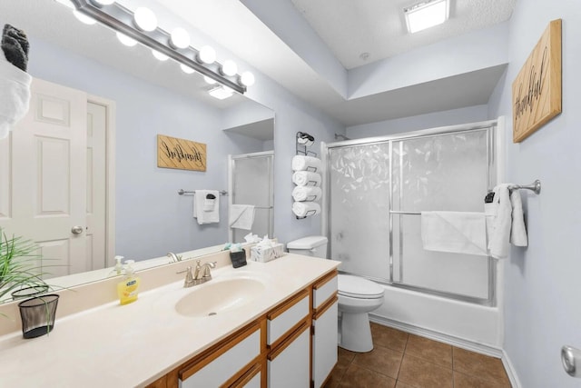 350 S Wildwood Dr Unit B-11, Branson, MO 65616 - full bath with toilet, vanity, tile patterned flooring, and enclosed tub / shower combo