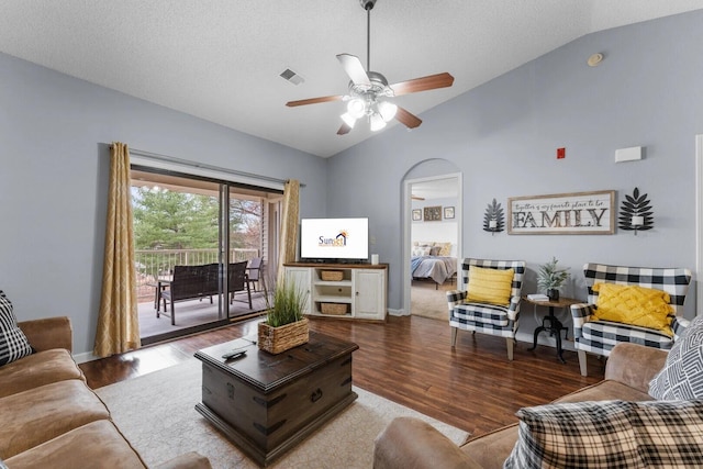350 S Wildwood Dr Unit B-11, Branson, MO 65616 - living area featuring lofted ceiling, wood finished floors, ceiling fan, and arched walkways