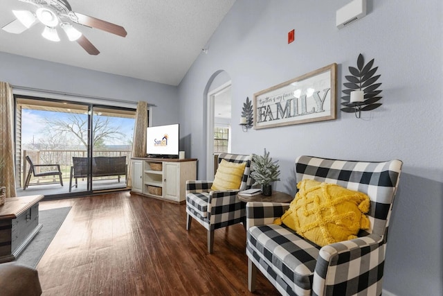 350 S Wildwood Dr Unit B-11, Branson, MO 65616 - sitting room featuring lofted ceiling, dark wood-style flooring, arched walkways, and ceiling fan