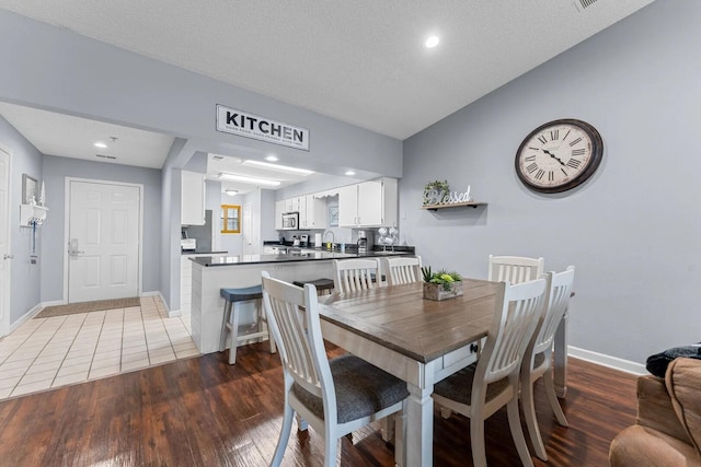 350 S Wildwood Dr Unit B-11, Branson, MO 65616 - dining room featuring baseboards, wood finished floors, and recessed lighting